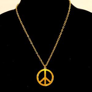 Glittery Peace symbol necklace on gold tone chain